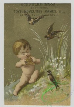prang_cards_kids-00414 - 1510-Trade cards depicting a cherub-sitting in a birds nest in the snow, playing an instrument for birds, playing with a wooden clog boat and in a shel 102149